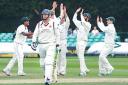 DREAM TIME: Last man Glen Chapple trudges off after being dismissed by Gareth Andrew who celebrates his third wicket in four balls during Lancashire’s first innings. Picture: EMMA PERRINS