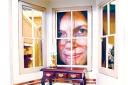 FURNITURE: Dawn Worthington takes a peep through a window of one of the dolls’ houses (46408201)