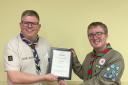Chief Scout for Warwichshire Paul Wakeley (left) presenting the award to Matthew Cook (right)