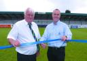 (L-R) Bromsgrove Rovers’ chairman Tom Herbert and All 4 One managing director Kim Williams cut the rope on the refurbished stand.