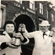 Andy Oakley and Rosa Dec with bottles of Lea & Perrins Worcestershire Sauce at the factory