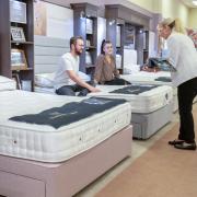 Sleep expert advising customers in Cousins’ Dudley showroom