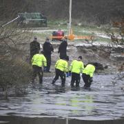 Police search teams at the scene in Babbs Mill Park
in Kingshurst, Solihull. Matthew Cooper/PA Wire