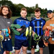 The four organisers of the asylum seekers’ football with boots loaned by The Harry Bennett Foundation (L to R) Joe Harvey-Elledge, Olly Kay, Elliott Boyden and Charlie Ellis.