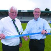(L-R) Bromsgrove Rovers’ chairman Tom Herbert and All 4 One managing director Kim Williams cut the rope on the refurbished stand.