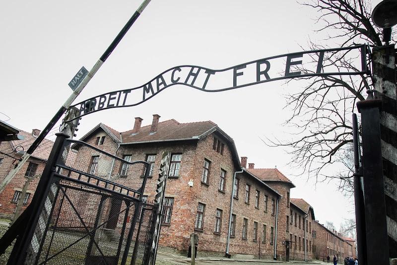 An archway at Auschwitz 1, displaying a phrase which translates in English as "work sets you free". (Photo: Yakir Zur)