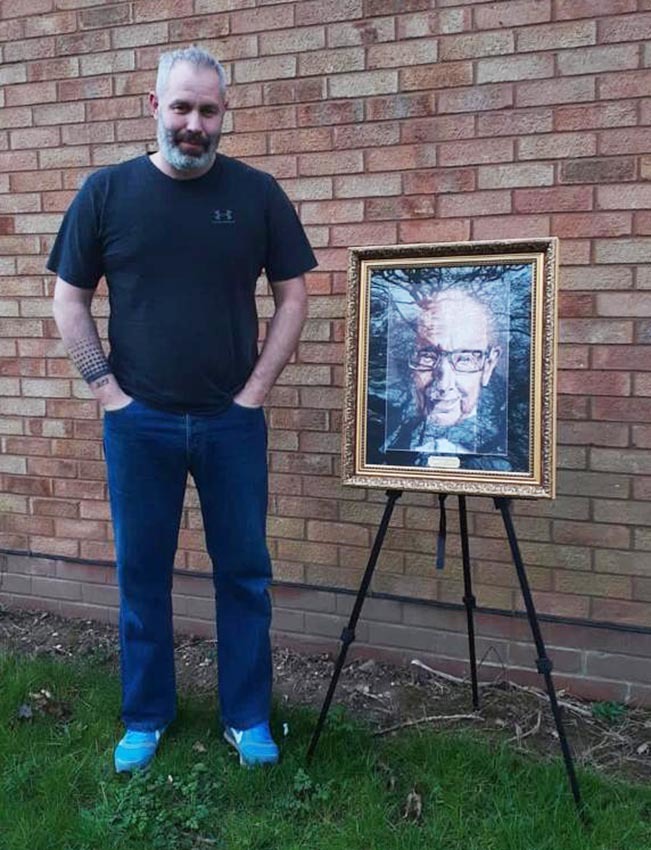 Artist Kevin Wills with his digital painting of Captain Tom 