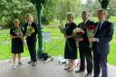Bromsgrove district councillors laying flowers at the Bandstand in Sanders Park.