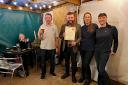 Paul Richards, Redditch and Bromsgrove CAMRA branch chairman, Chris Lamb, licensee of The Weighbridge Inn, Caroline Spreckley, assistant manager and Amy Fletcher, staff member.