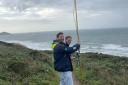 Exeter University students searching for a lost tuna radio tag on Whitsand Bay.