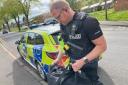 SEIZED: Police seize the Nottingham Knocker's bag in Malvern