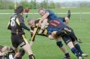 CRASH, BANG, WALLOP: (Left) A Droitwich player feels the force of a tackle from two opponents.