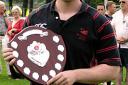 CHAMPIONS: Bromsgrove second team captain Andy Murdoch collects the league trophy.