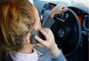 The footage is analysed using artificial intelligence to determine if motorists were using a handheld phone (PA)