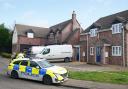 MURDERL Police at the scene in The Row in Sutton, near Ely, Cambridgeshire, where police found the body of a 57-year-old man who had died from gunshot wounds on Wednesday evening.