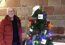 Gay Outdoor Club local organiser David Millar with the group's tree at the Worcester Cathedral Christmas Tree Festival