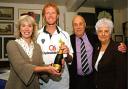 CORKS POPPING: Julie Kirkbride hands Dougie Brown the man of the match champagne, while club president Mike Burke and Barnt Green Conservative chairman Betty Ingram look on. Ref: NT05987