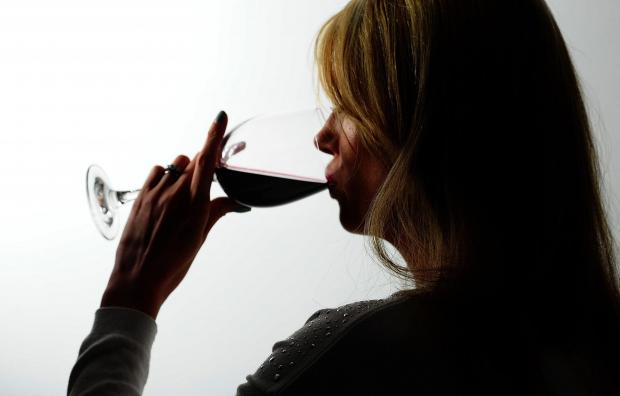 Bromsgrove Advertiser: A woman drinking red wine. Credit: PA