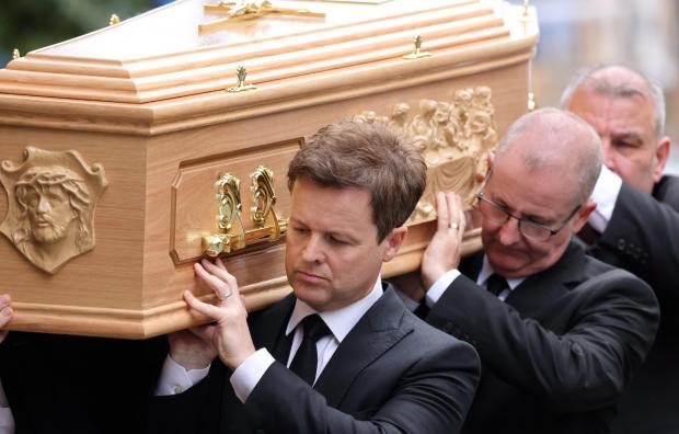 Bromsgrove Advertiser: Declan carries his brother's coffin. Picture: NORTH NEWS