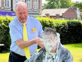 Bromsgrove Advertiser: Rod Laight enjoying pie splatting chief executive of Bromsgrove District Council and Redditch Borough Council Kevin Dicks.