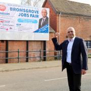 Bromsgrove MP, Sajid Javid with jobs fair banner.