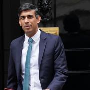 Rishi Sunak has been compared to a 'cardboard cut out' after standing next to the tallest UK MP