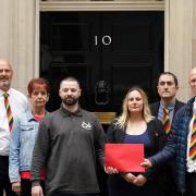 Relatives of victims of the NHS infected blood scandal (left-right) Temple Jones, Janine Jones, Jason Evans, Gemma Holding, Tim Wratten and Chris Smith hand in a letter to 10 Downing Street.