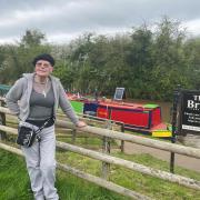 IDYLLIC: Lynne Bisset, landlady of The Bridge at Tibberton, stands in the pub's beer garden overlooking the canal