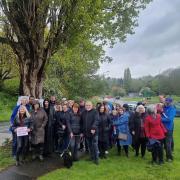 Campaigners next to a tree set to be chopped down